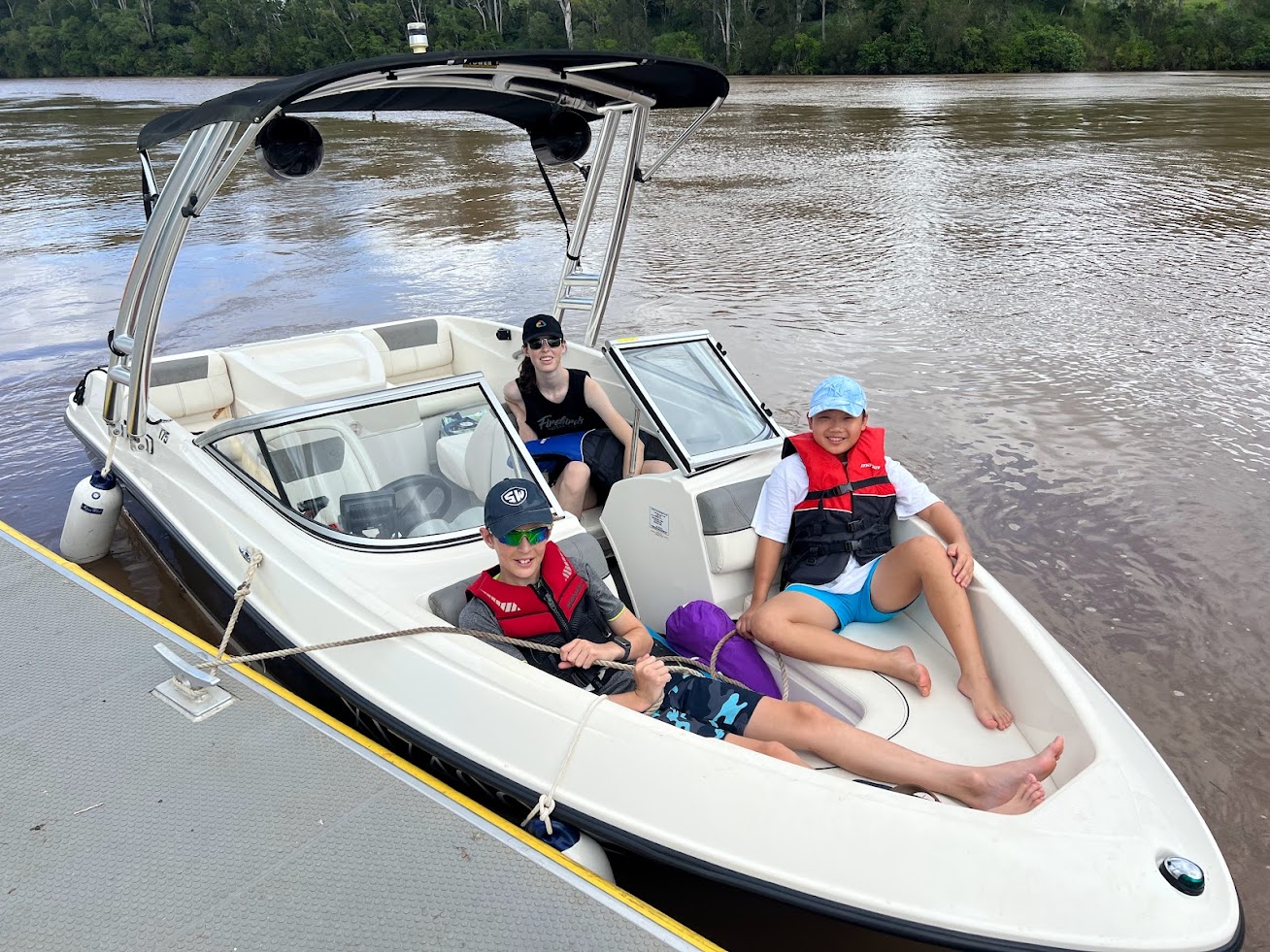 2014 Bayliner 175 bowrider boat with family enjoying water activities